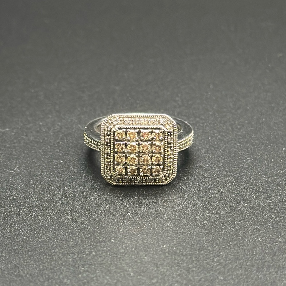 Chocolate and clear diamond ring set in sterling silver, size 6.